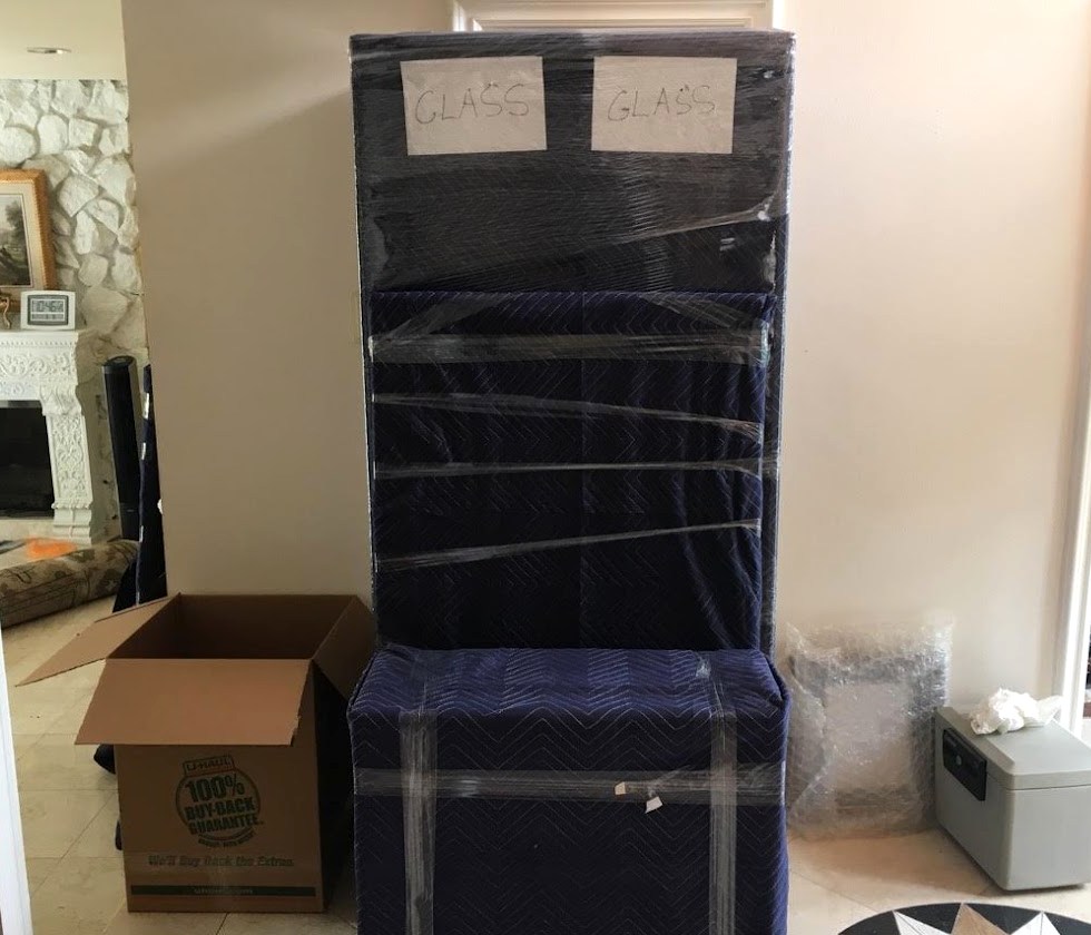 Wrapped cabinet prepared inside a home before moving