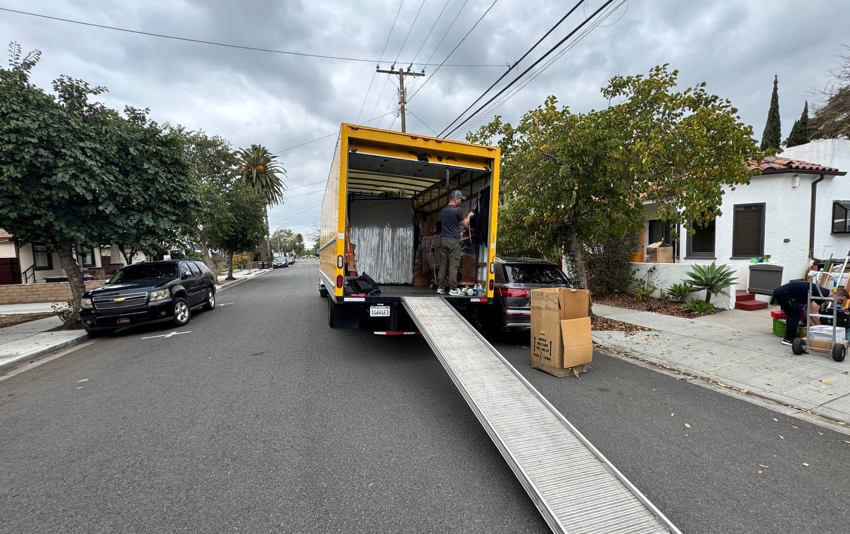 LA Moving truck parked on a Los Angeles street with the loading ramp extended